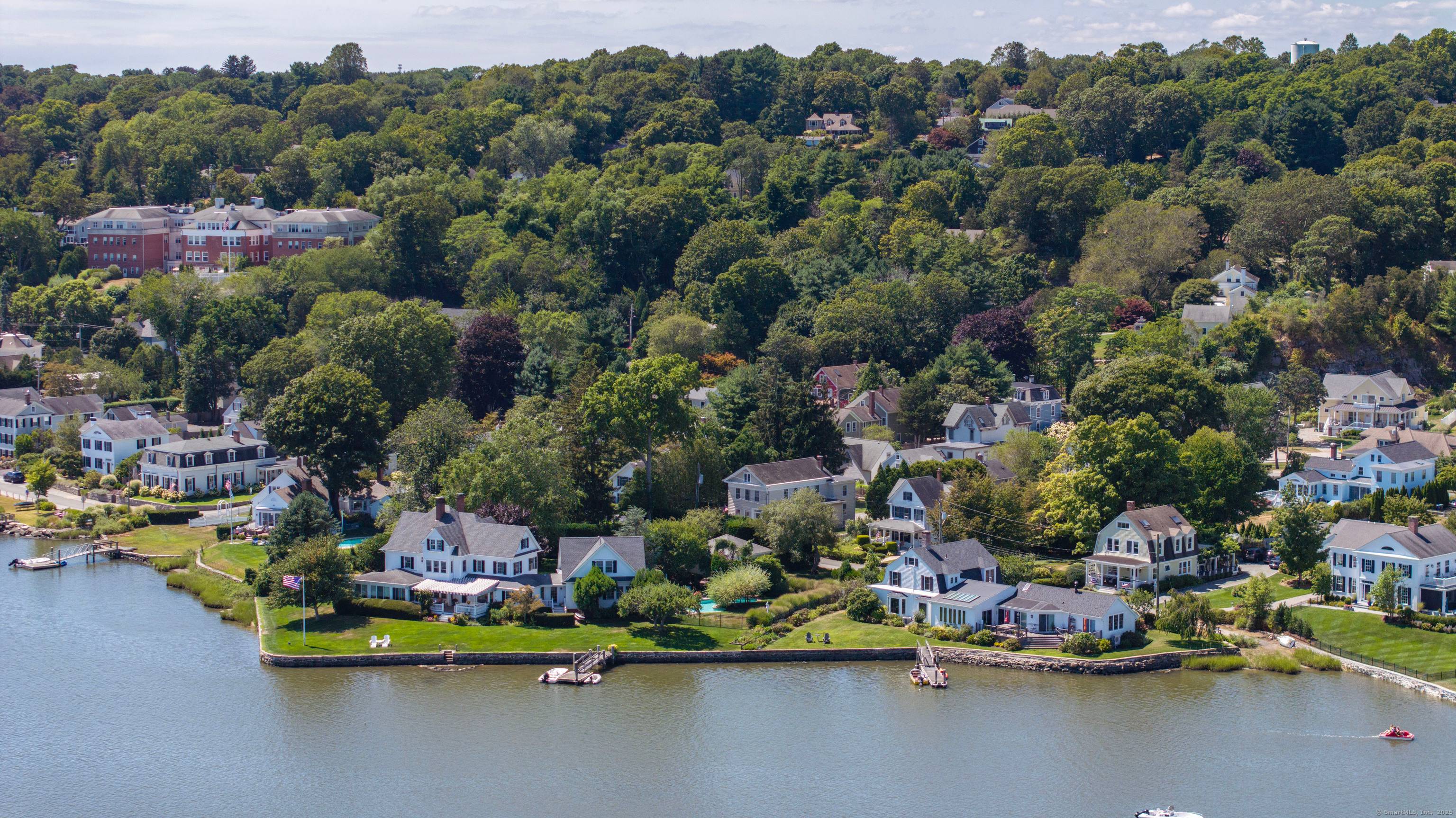 Welcome to 5 Park Place a truly rare opportunity to own a remarkable property on one of Mystic's most coveted waterfront streets.