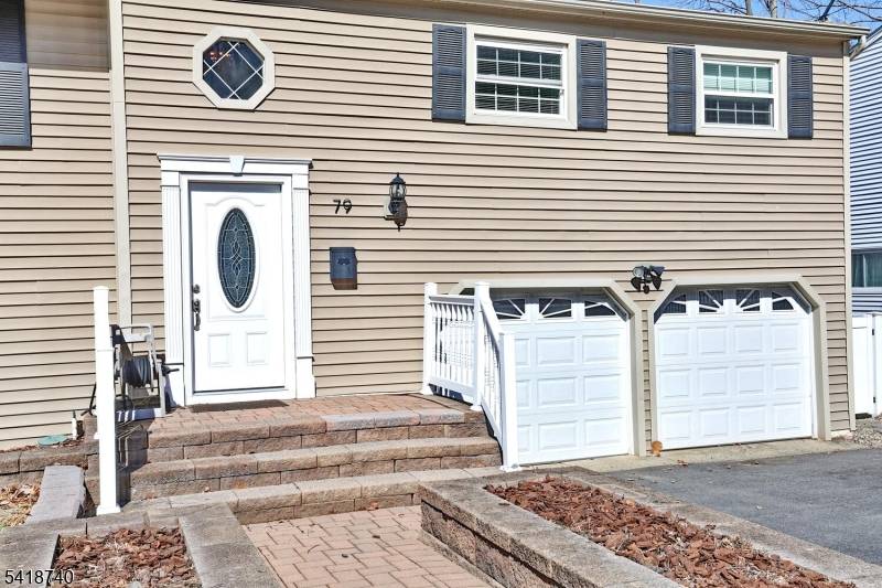 Move in ready and lovingly maintained, this inviting bi level sits in a prime location near highways, shopping, parks, and schools.