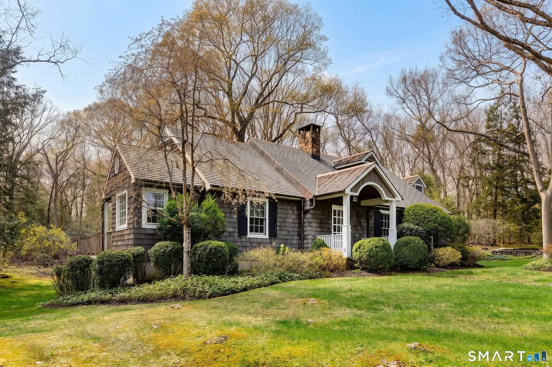 Situated in Roxbury near the Washington border, this quintessential 1960's four bedroom Cape Cod with heated pool, serves as a private sanctuary, harmonizing classic New England architecture with modern refinements.