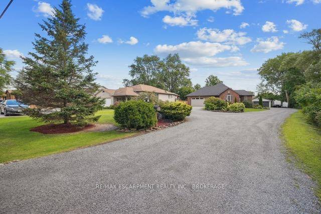 This one owner custom built home sits on nearly 2 acres in Wellands west end, offering country privacy with city convenience.