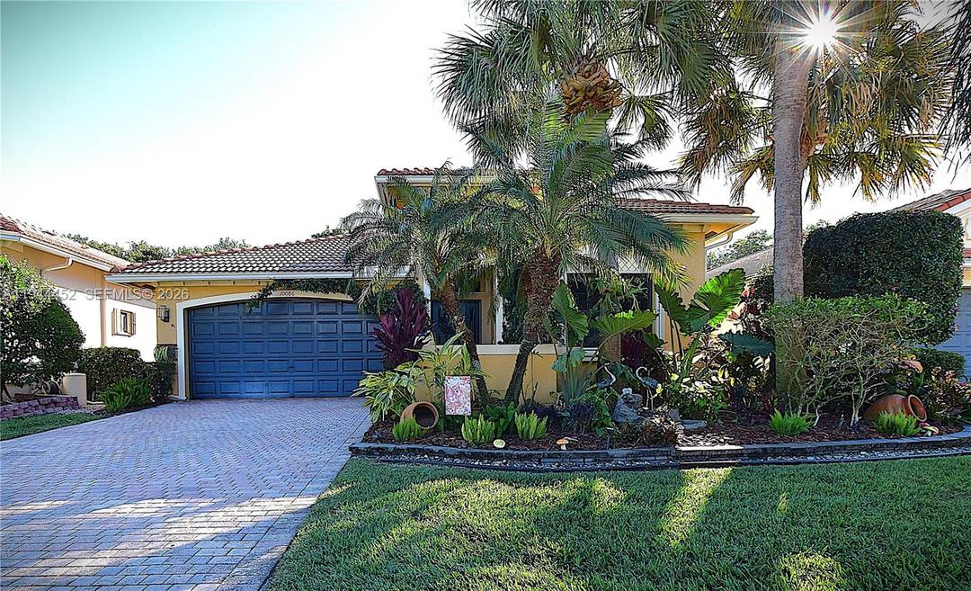 This beautifully updated 3 bedroom home in Tivoli Lakes greets you with a spacious open floor plan, a charming foyer, and lush landscaping surrounding the front, sides, and back.