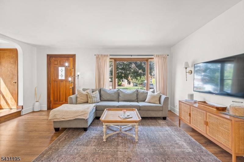 Experience the perfect blend of 1930s character and modern luxury in this stunning 3 bedroom, 2 bath Tudor inspired home located just steps from the scenic Brookdale Park.