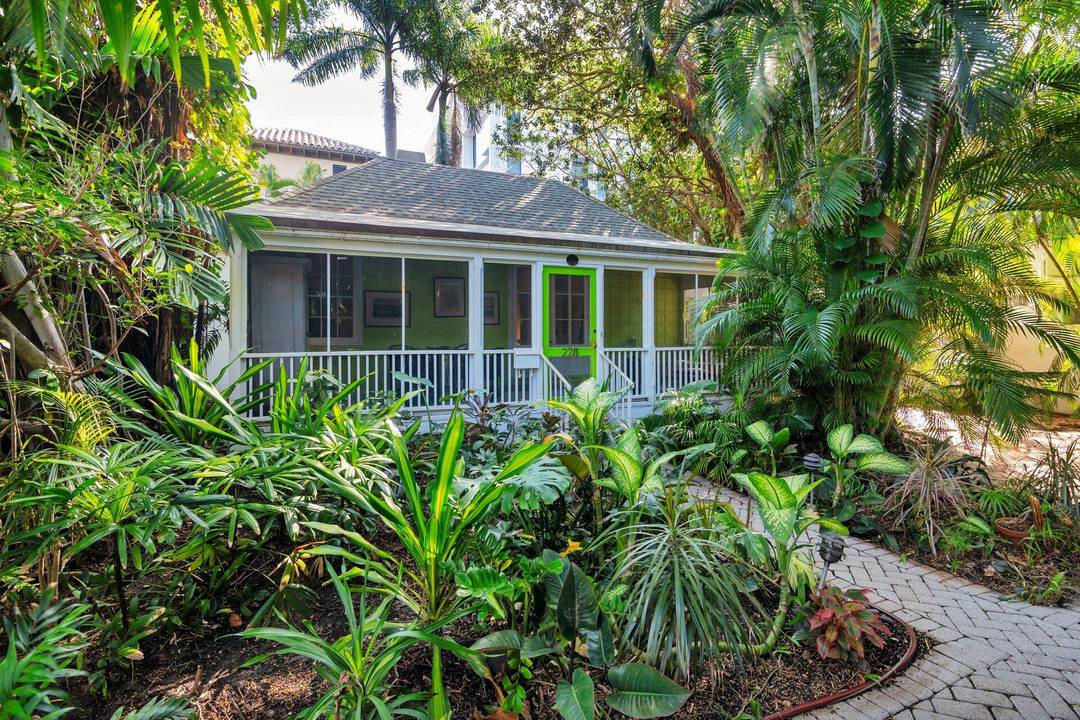 Walk back through time as you approach architect Howard Major's personal cottage nestled in historic Phipps Plaza, one block from the Ocean in midtown Palm Beach.