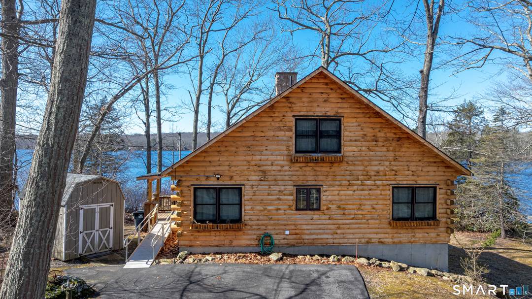 Welcome to your own private lakeside retreat, where rustic charm meets breathtaking waterfront living in this beautifully crafted log cabin set directly on the lake.