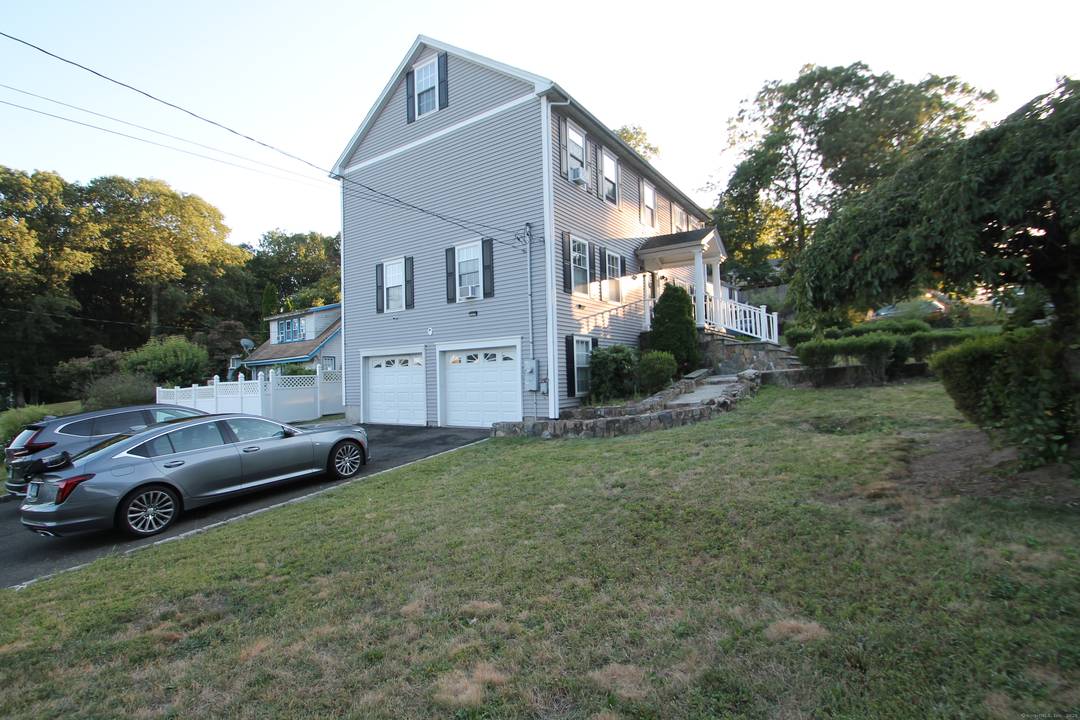 Colonial style home with possible In Law featuring 11 Rooms 4 5 Bedrooms 3 full Bathrooms.