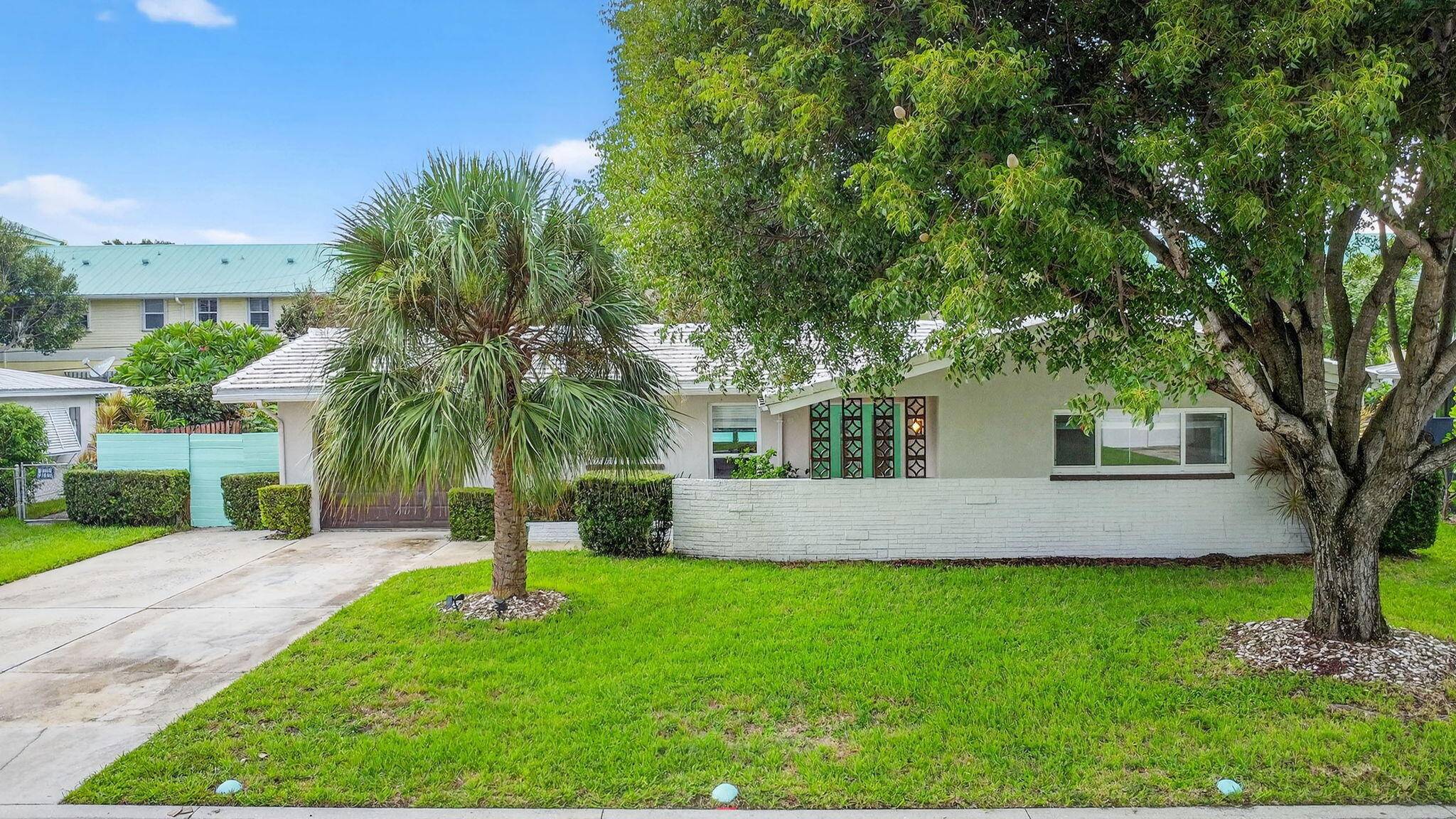 Beautifully updated 3BR 2BA mid century pool home located in the desirable waterfront community of Hypoluxo Shores, just steps away from the intracoastal.