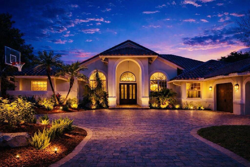 FABULOUS DESIGNER REMODELED FAMILY POOL HOME IN THE PRIVATE GATED COMMUNITY OF CYPRESS HEAD.