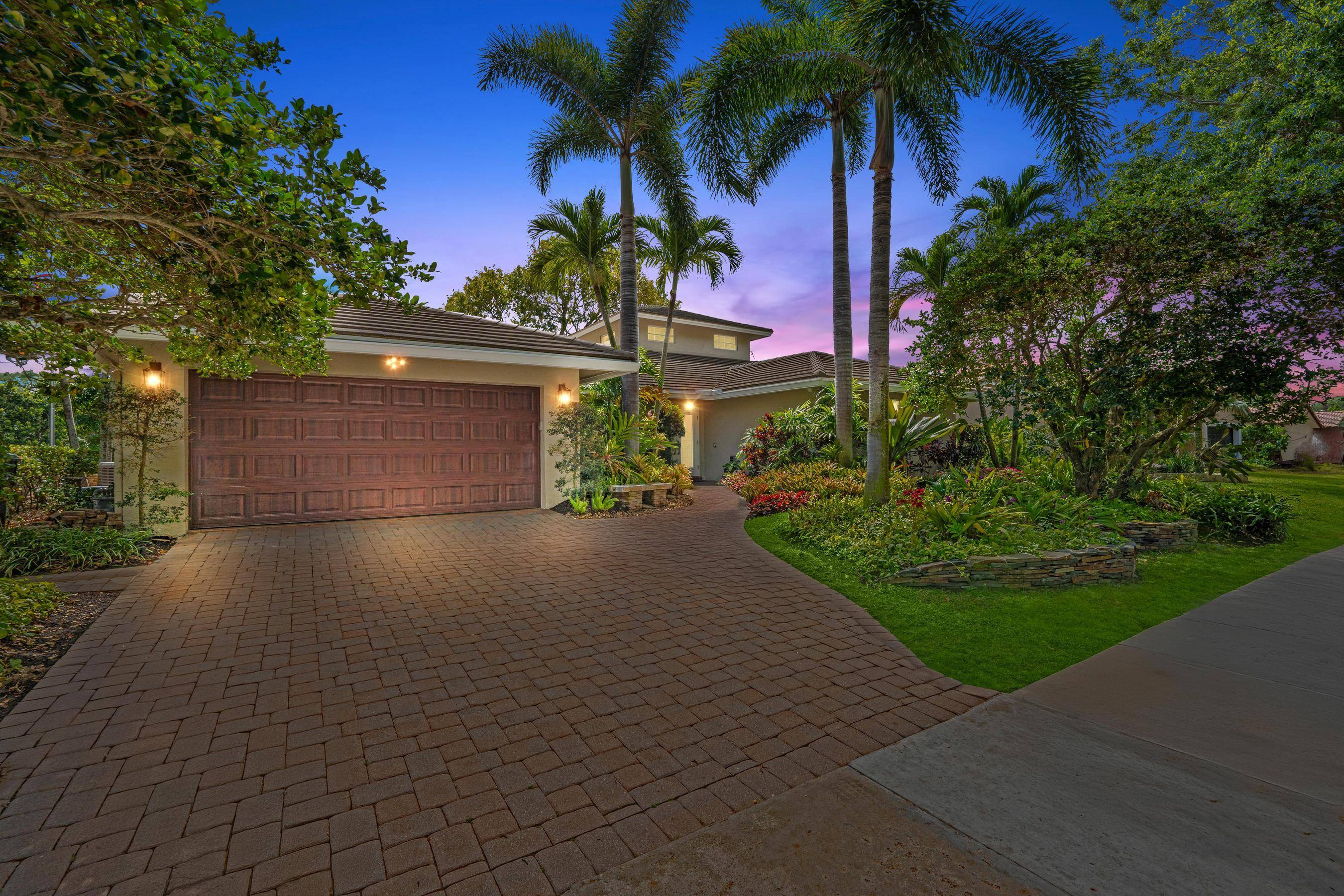 Welcome Home to 3518 Pine Haven Circle a one of a kind luxury retreat in the heart of Boca Raton's sought after Millpond community.