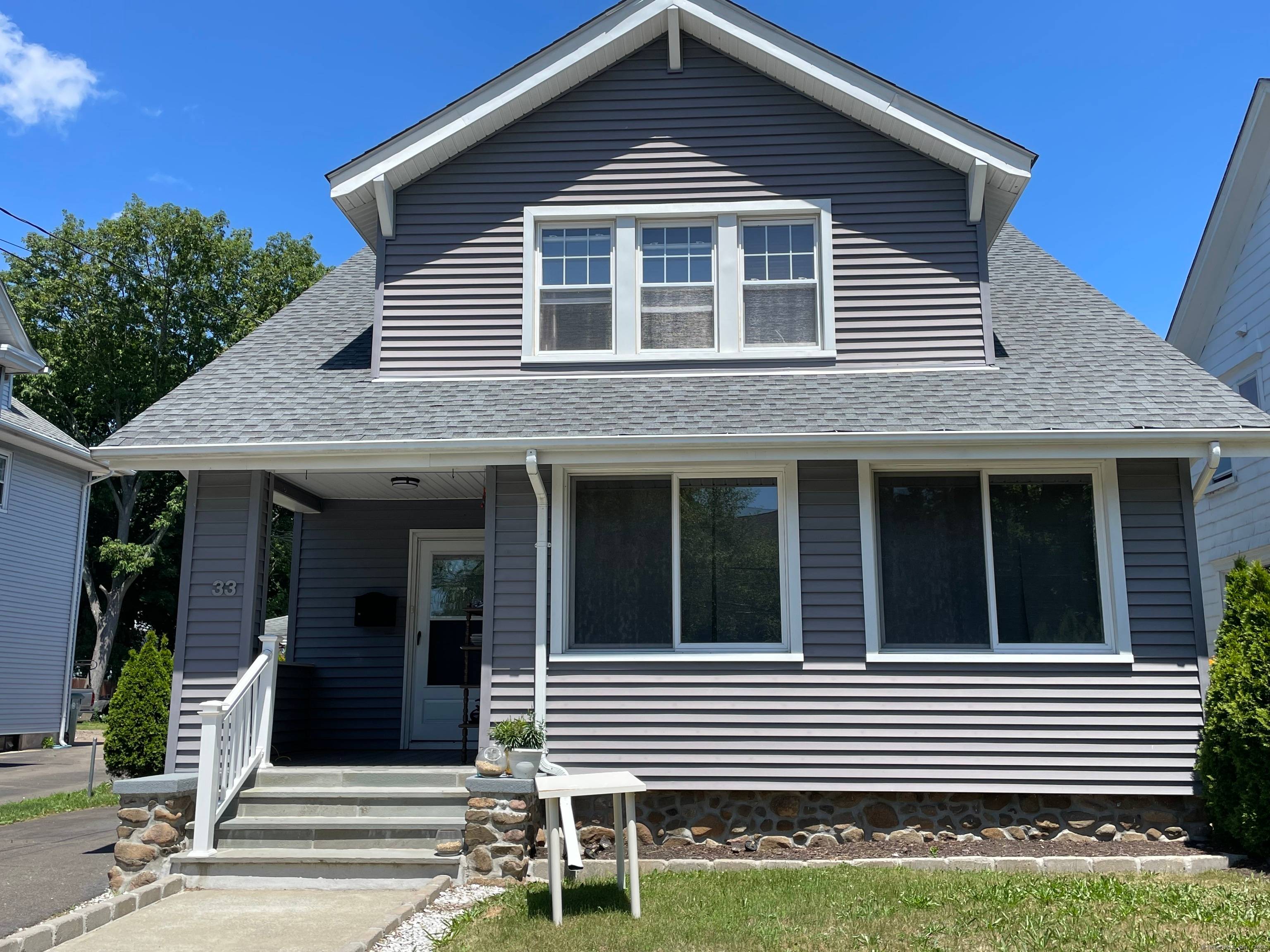 Spacious Arts Crafts home with new kitchen and 2 new full baths ; HW floors throughout ; entry foyer with Fr.
