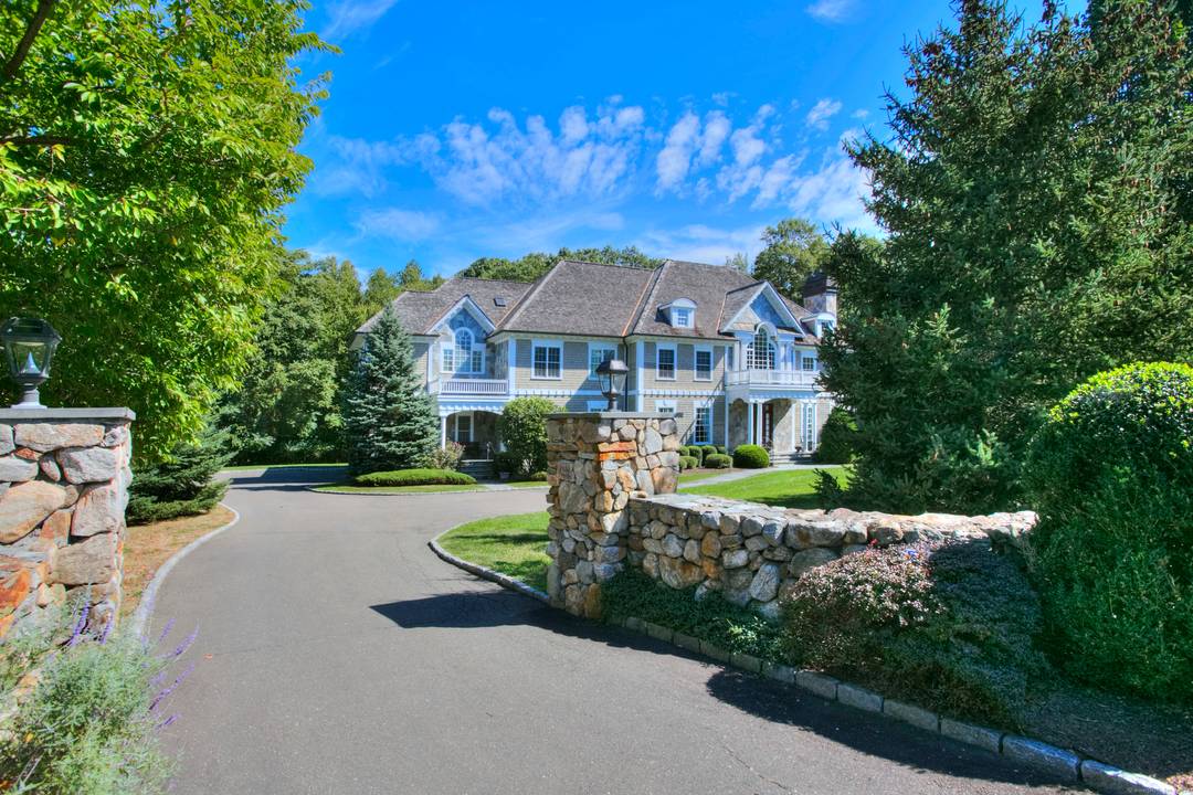 Modern elegance meets estate living at 88 Merry Meet Circle, set on 3 manicured acres in Fairfield's premier gated community, The Ridge.