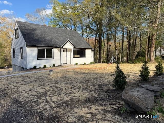 This fully renovated Cape style home offers 4 spacious bedrooms and 2 baths, all set within a serene natural oasis.