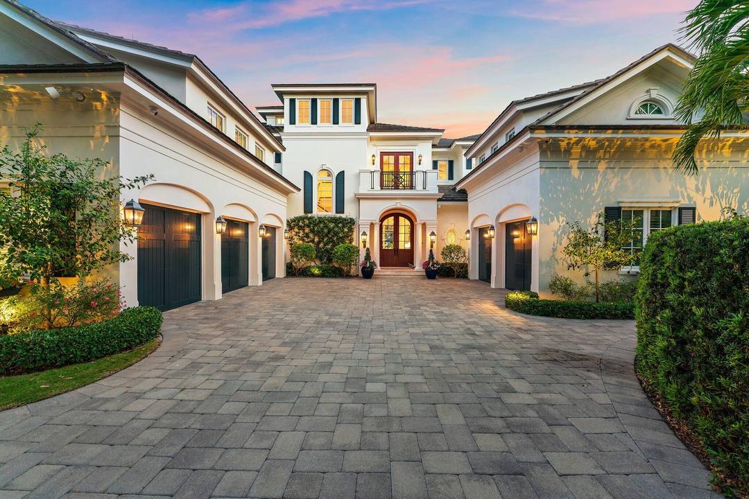 Stunning British West Indies inspired estate set on a rare point lot, offering over 180 ft of deep, navigable waterfront and exceptional southern exposure with sweeping multi directional views.