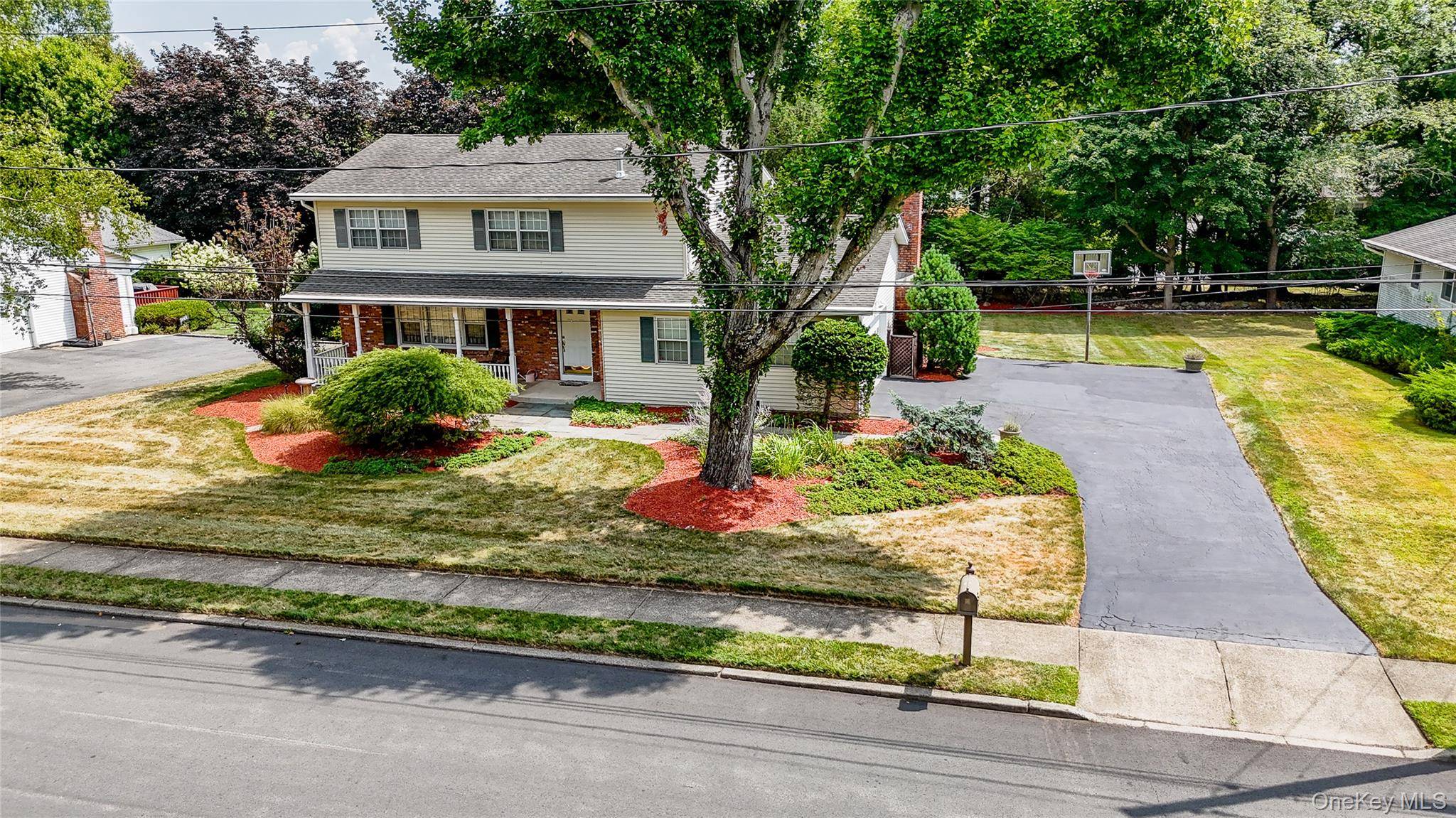 Must see this pristine colonial in Ungava Farms, set on a spacious lot with a charming porch, bluestone walkways in the front, back, and patio, a large driveway, outdoor lighting, ...