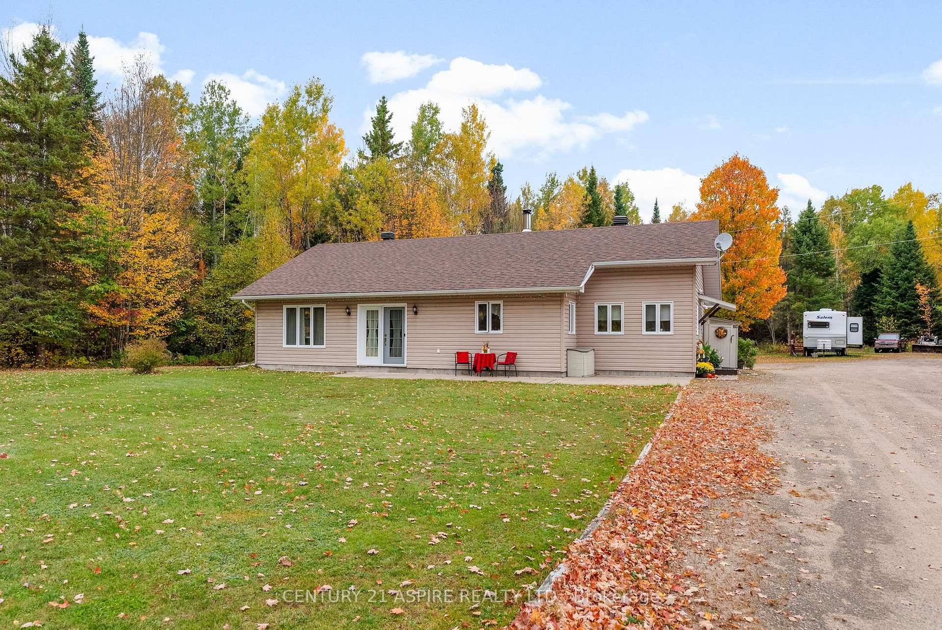 This inviting 2 bedroom bungalow offers a perfect blend of comfort and functionality, set on a private 1.