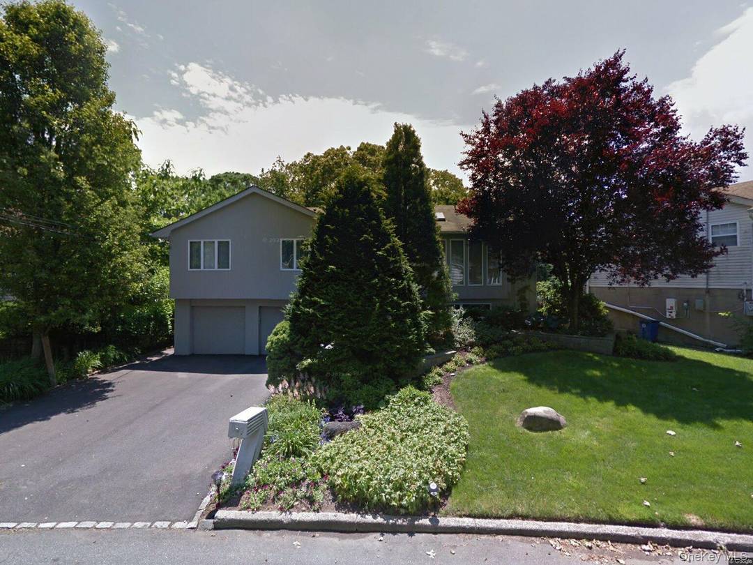 Welcome to 22 Pickwick Hill Drive, a spacious 4 bedroom, 2 bathroom residence where natural light and architectural charm take center stage.