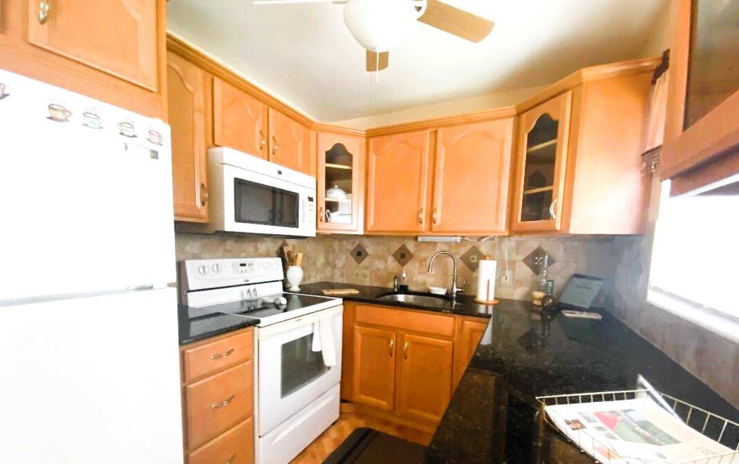 Updated 2 bedroom 1. 1 2 bath second floor condo fully furnished in the heart of Century Village.