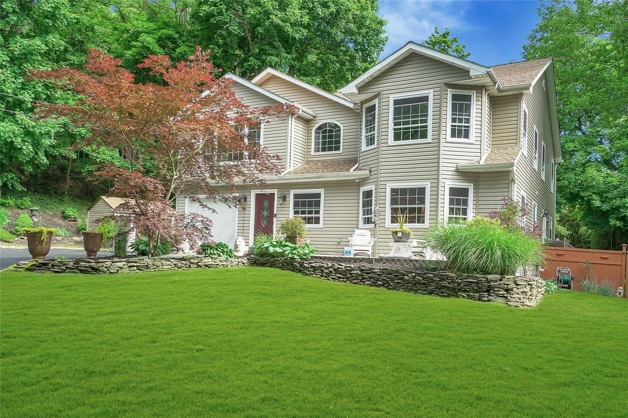 Enjoy privacy and serenity on the pastoral grounds of this five bedroom home with close to 1.