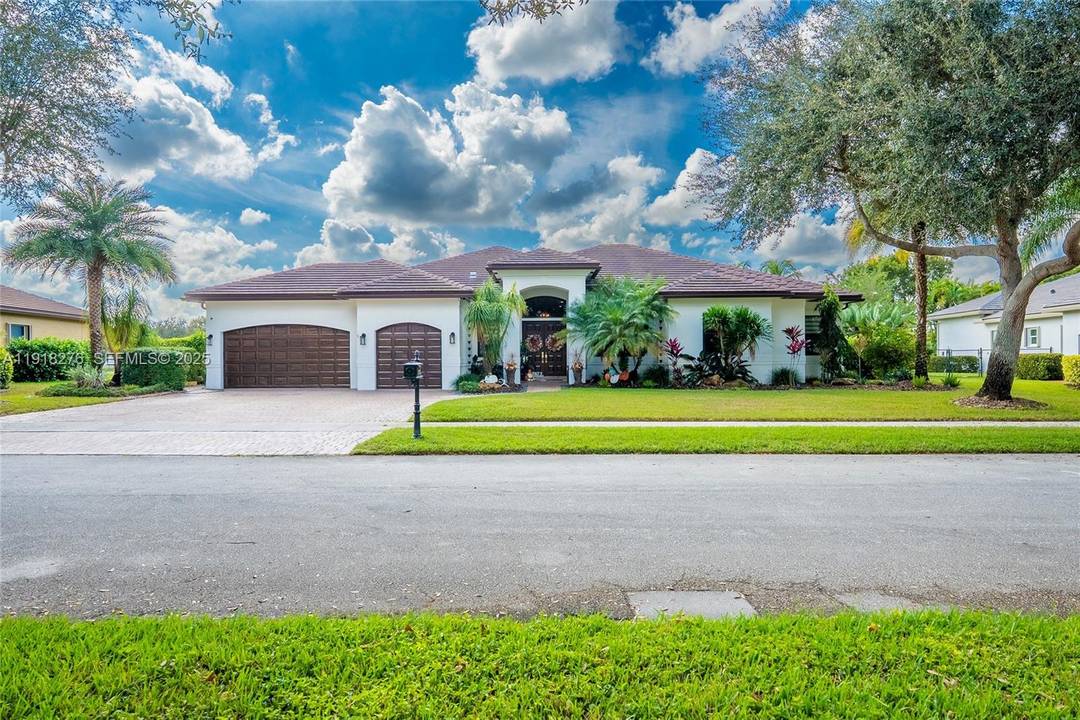Step into this beautifully upgraded Dover model, perfectly situated on a serene lakefront lot in Imagination Farms one of Davie s most coveted guard gated communities.