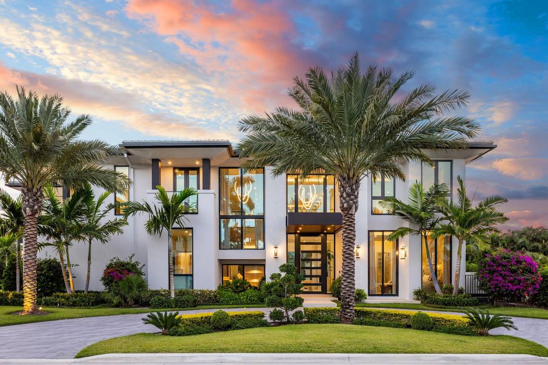 2498 Queen Palm Drive in Boca Raton's Royal Palm Yacht Country Club stands as a newly completed, fully furnished 6 bedroom, 8.