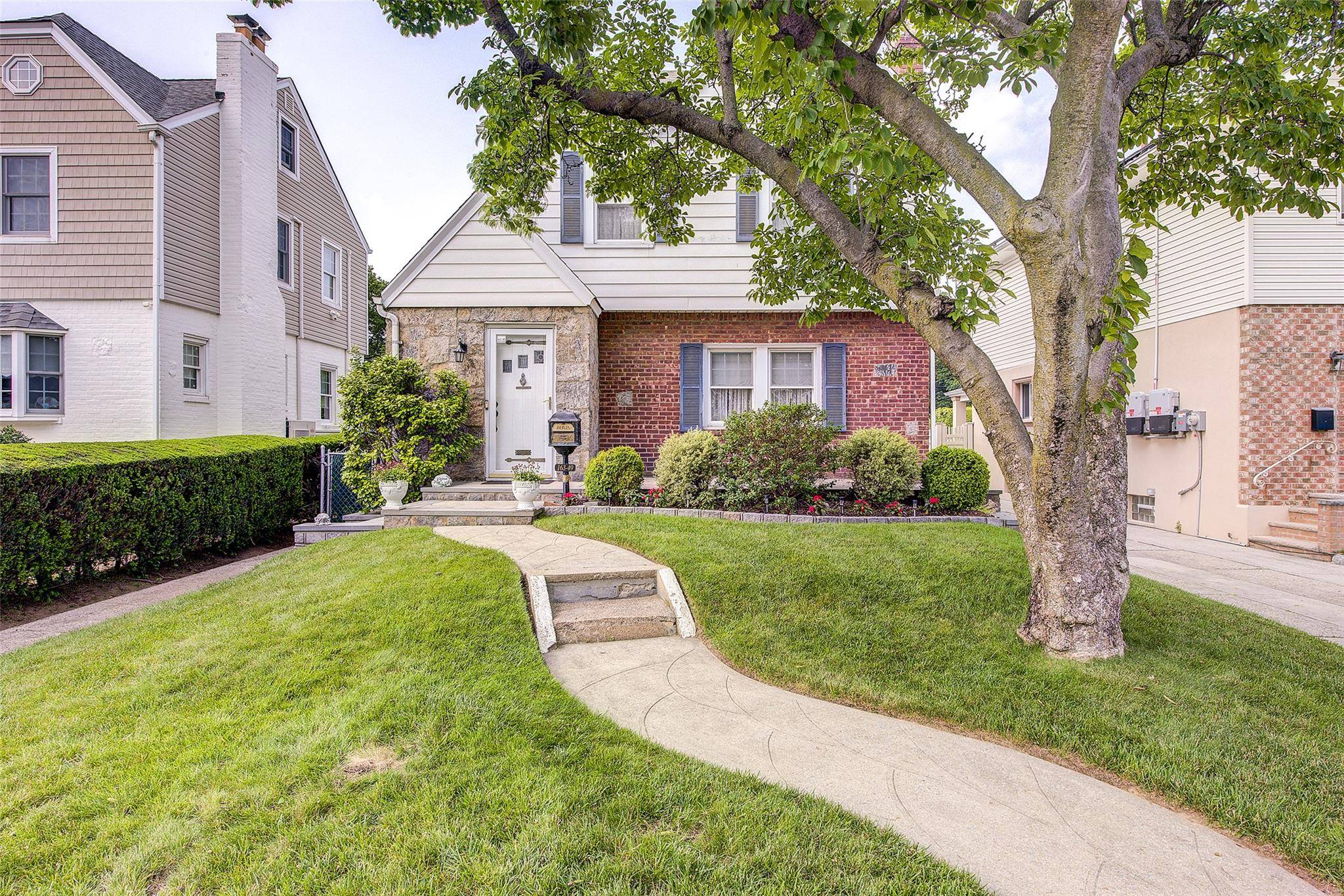 This beautifully maintained two family home is nestled on a quiet residential block in prime Whitestone.