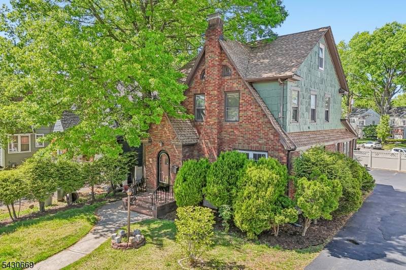 Beautifully updated Tudor style home located in desirable Roselle Park offering the perfect blend of modern updates, functional space, and commuter convenience.