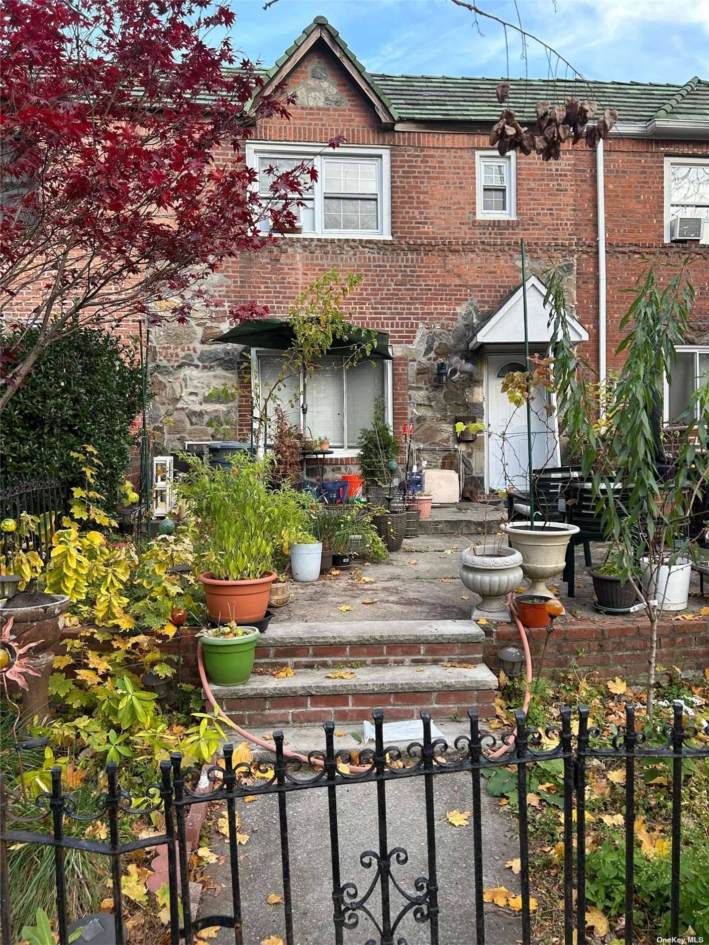 Attached single family home, solid brick, in a convenient Woodside location.