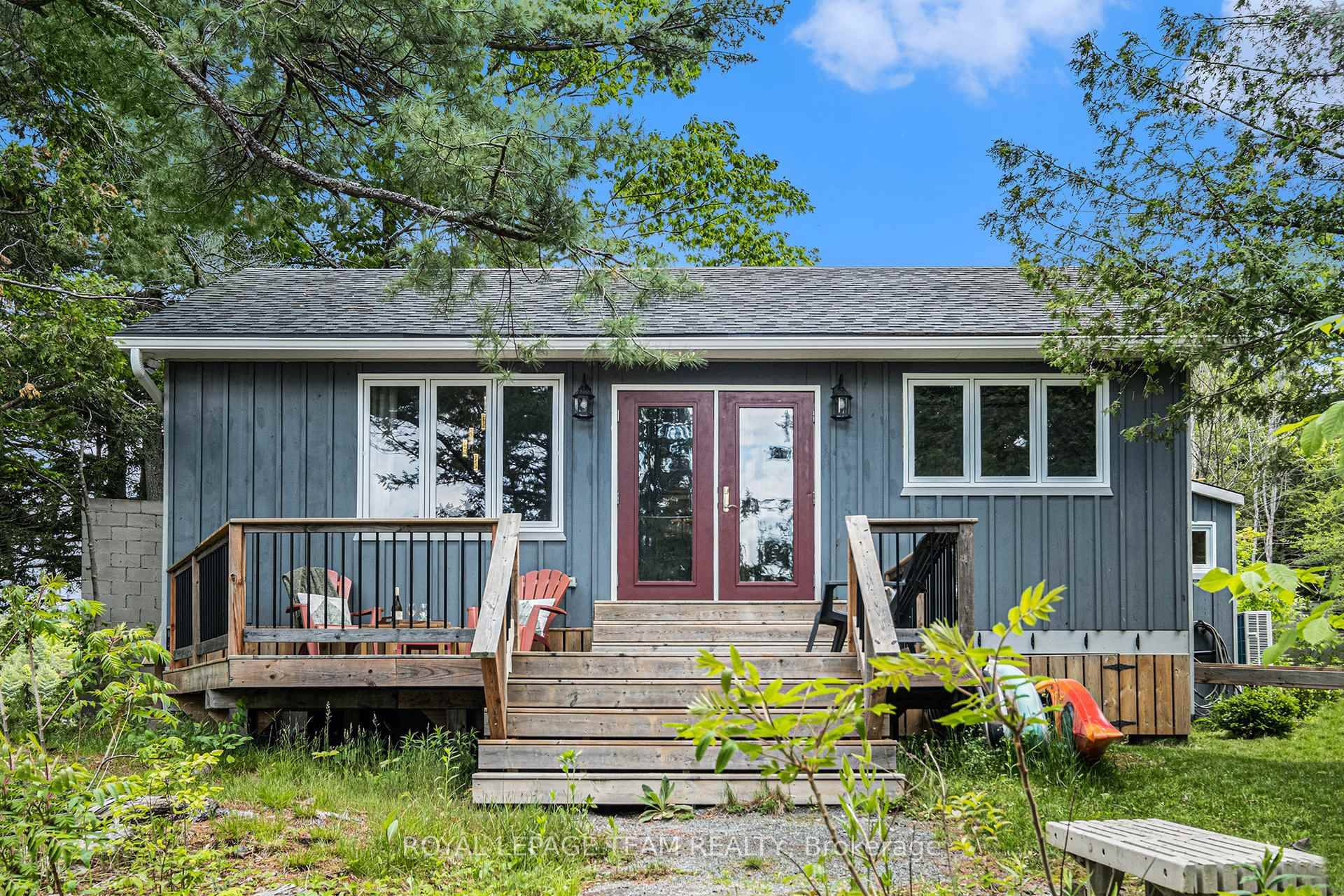 Enjoy your perfect summer escape at this rare find on Charleston Lake, a short 1.