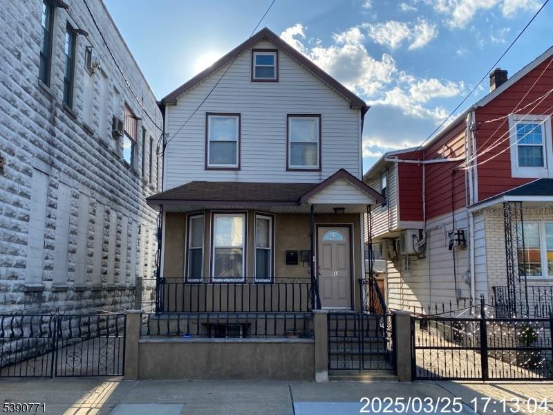 Welcome to This Well Maintained Two Family Home !