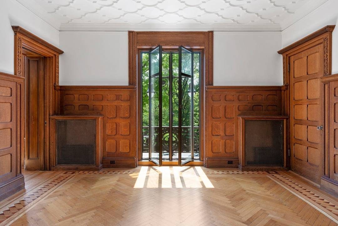 Stunning views into Central Park from the expansive and stunning living room, library, formal dining room, and master bedroom.