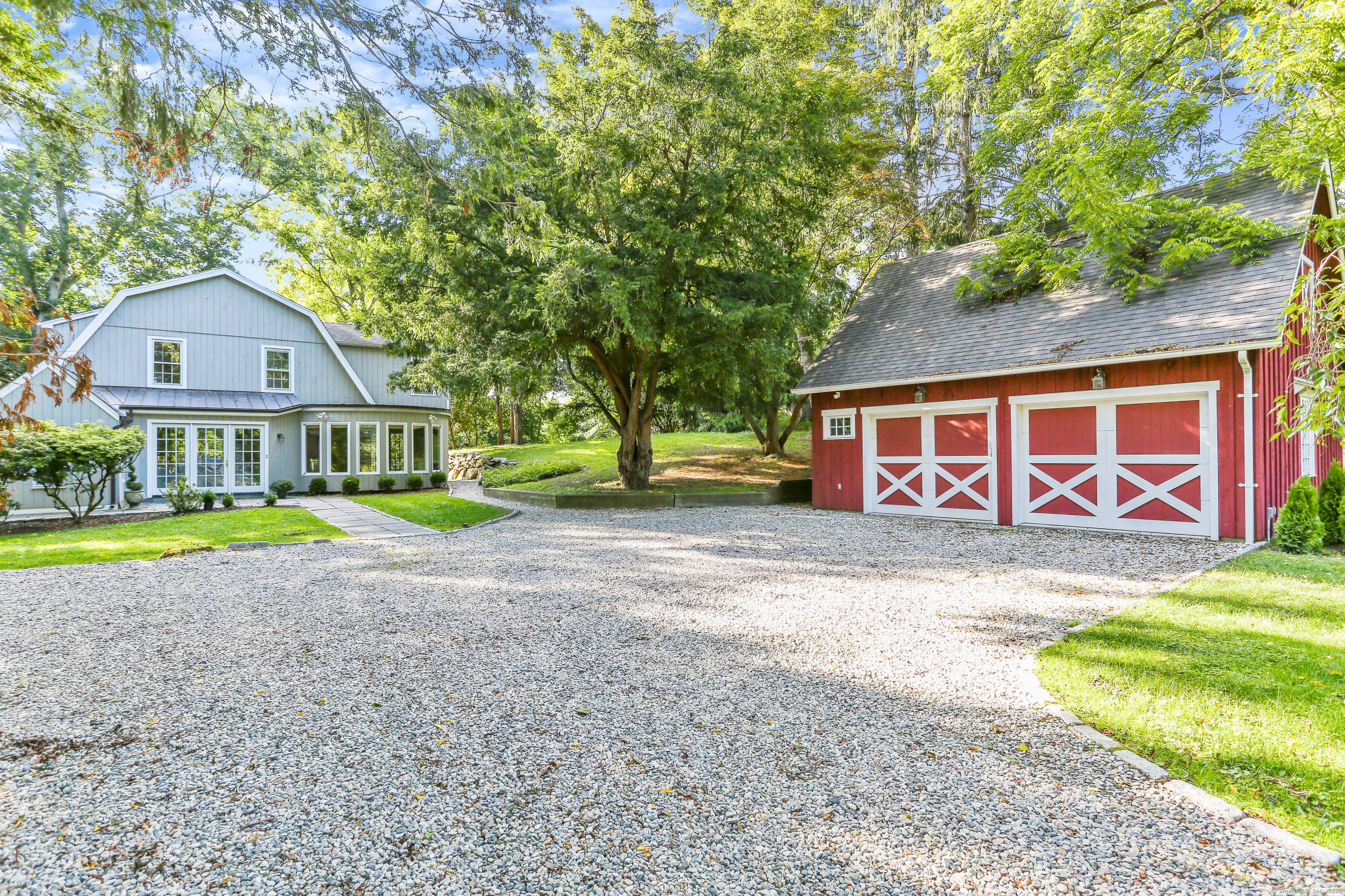 This delightful, sun filled home, nestled on beautiful park like grounds, offers the perfect blend of modern amenities and timeless charm.