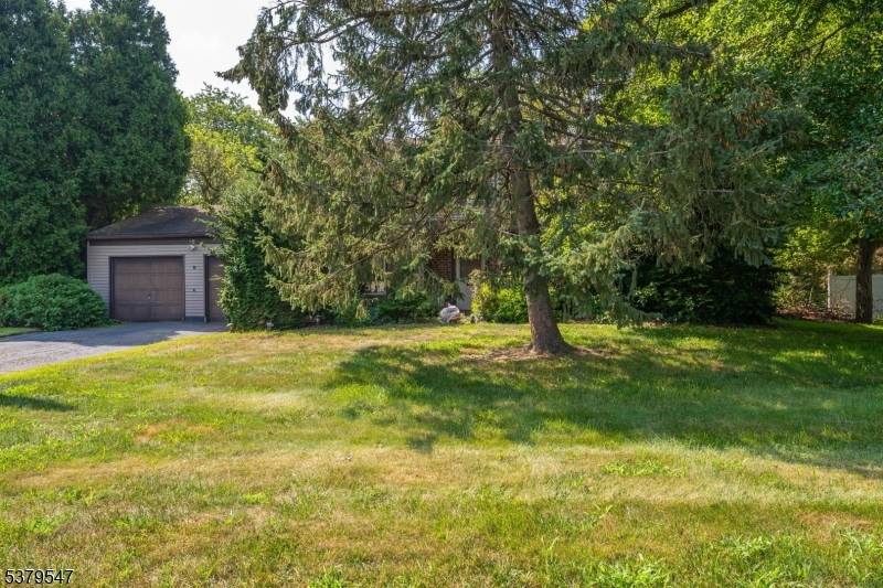 Discover the potential in this spacious 4 bedroom home located in a beautiful section of Manalapan.