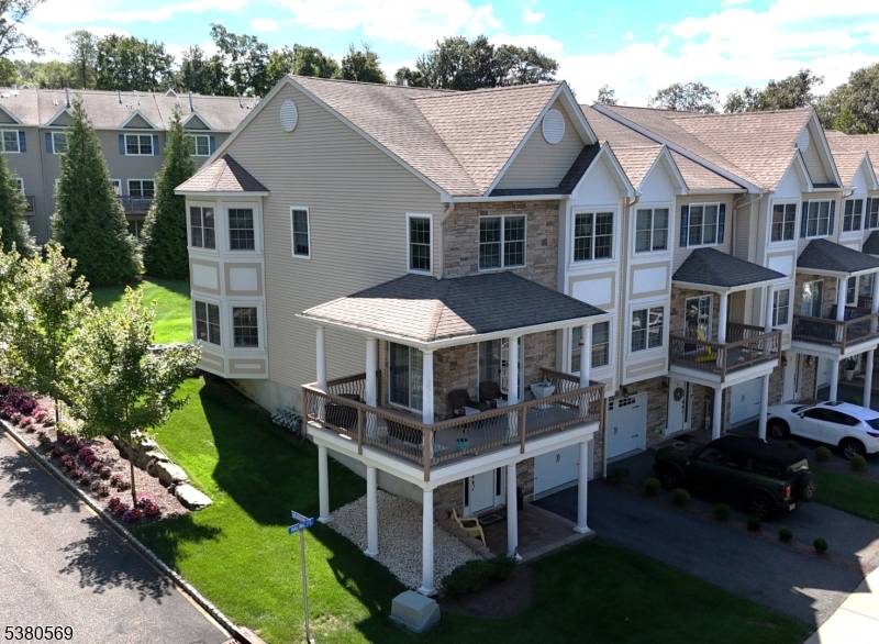 This exceptional 3 bedroom, 3 and a 1 2 bath end unit features a rare wraparound deck that offers stunning mountain views.