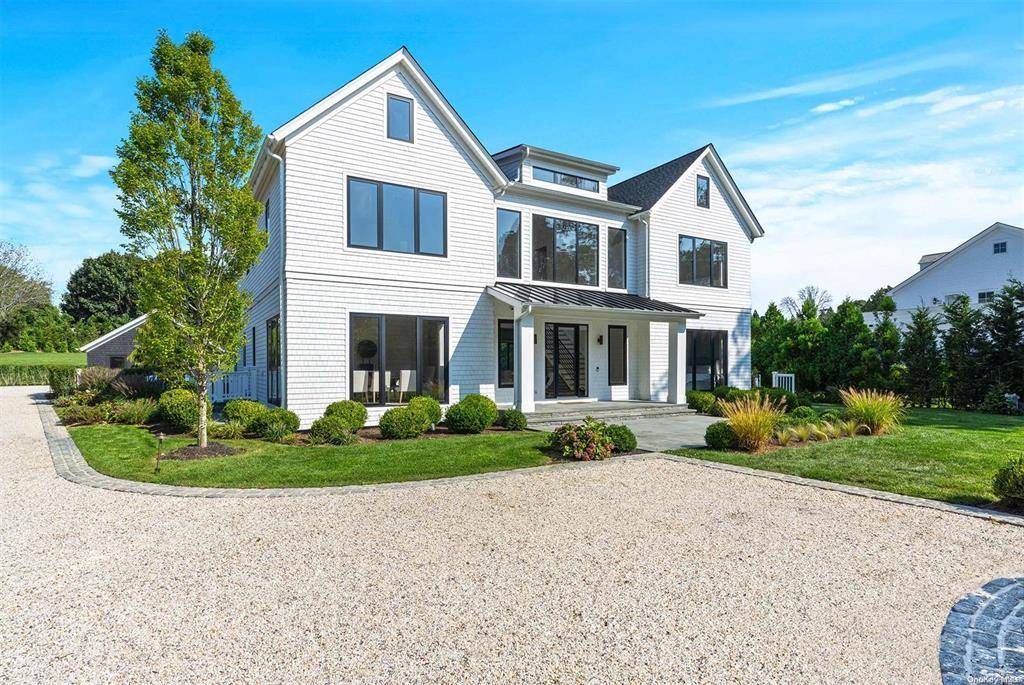 This stunning modern home offers luxurious living on 1.