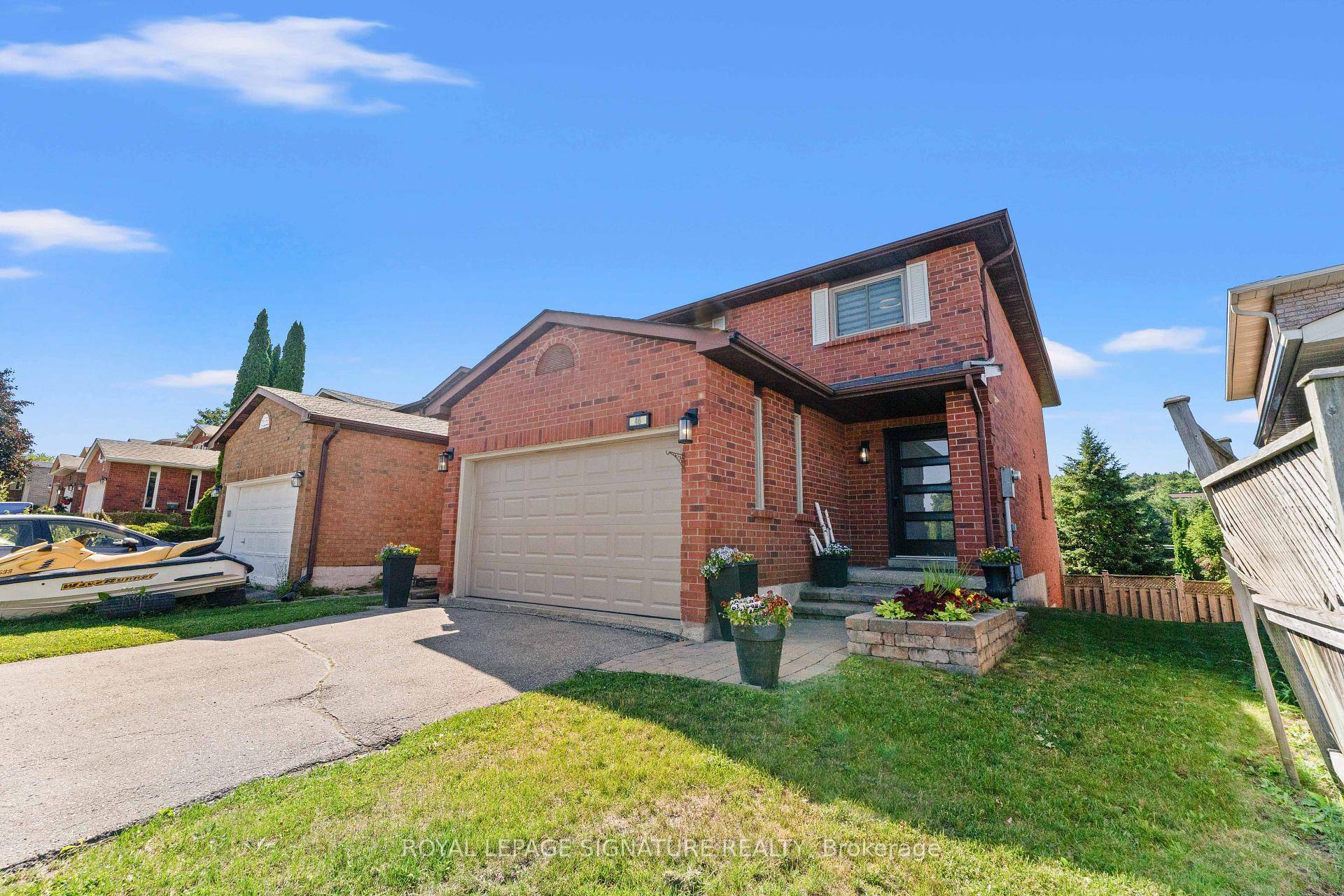Renovated 4 Bedroom Home with Finished Walk Out Basement !