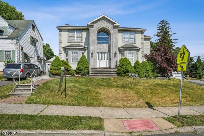 Welcome to this beautifully appointed 5 bedroom, 4 bathroom center hall colonial, offering a timeless and functional finishes throughout.