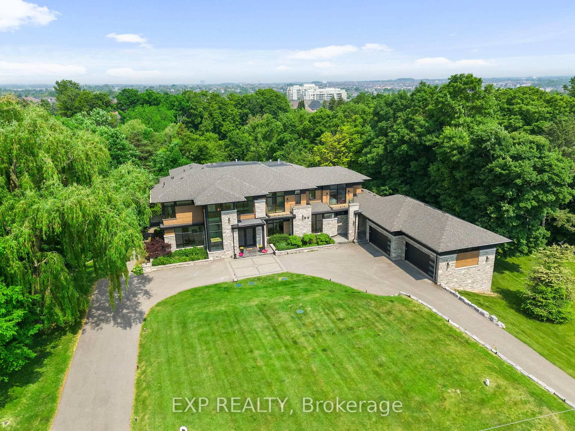 Set on a rare 1. 92 acre ravine lot, over 10, 000 sq ft custom built estate by David Small Designs blends serene Canadian elegance with bold global influence.