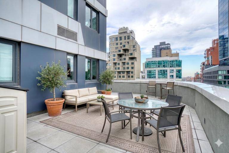 Enjoy 873 sq ft of interior living space and an incredible 951 sq ft private terrace in a luxury condominium building with a 421 a tax abatement.
