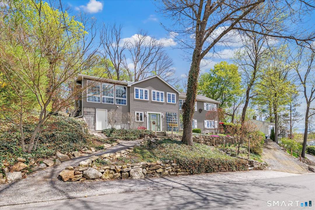 Set on an expansive parcel in Brookfield's Candlewood Shores, 13 Longview Drive offers a rare blend of space, flexibility, and lifestyle in a setting known for its enduring amenities ever ...