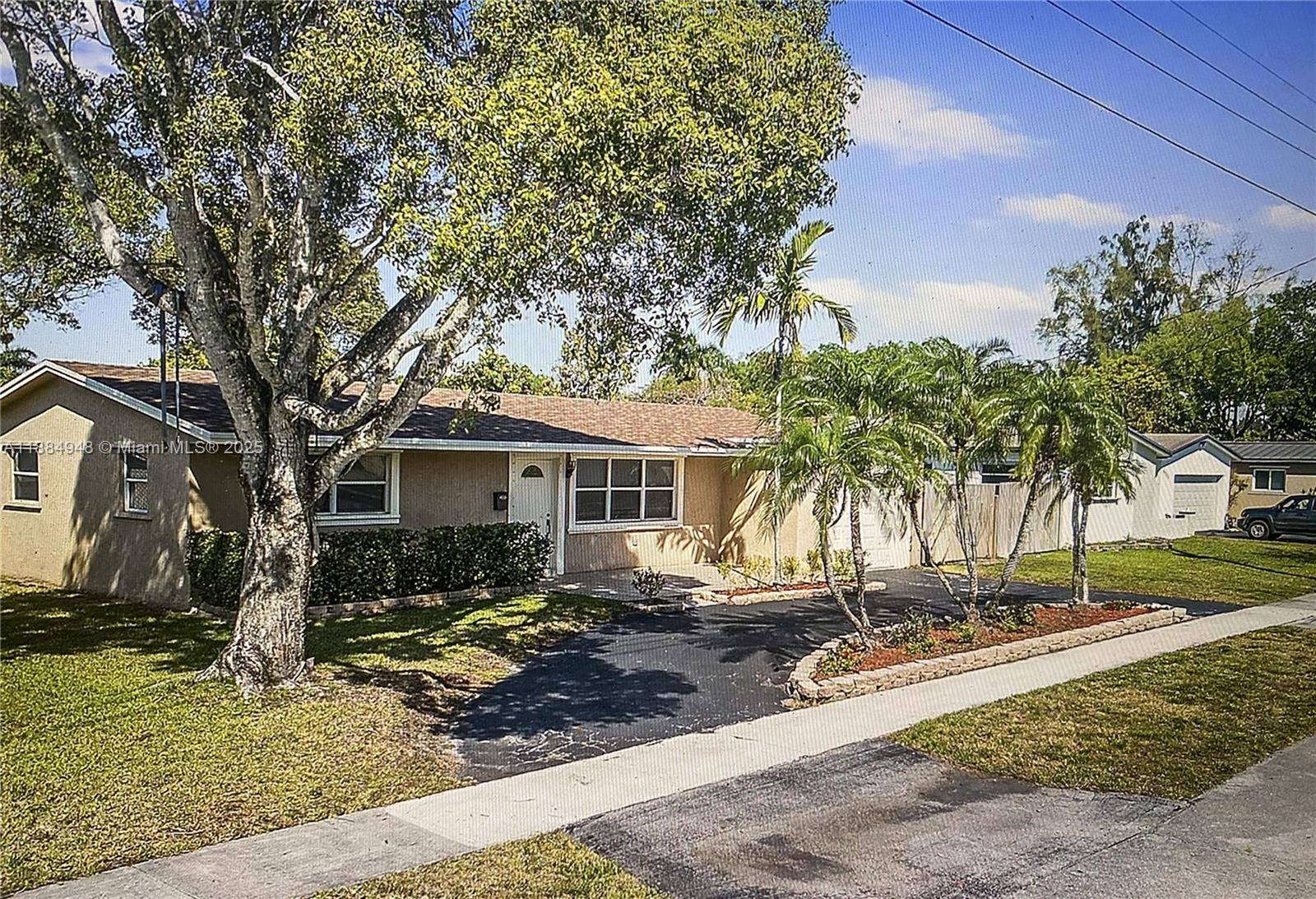 Welcome to this charming 3 bedroom, 2 bathroom home located at 5231 SW 89th Ave in Cooper City, FL.