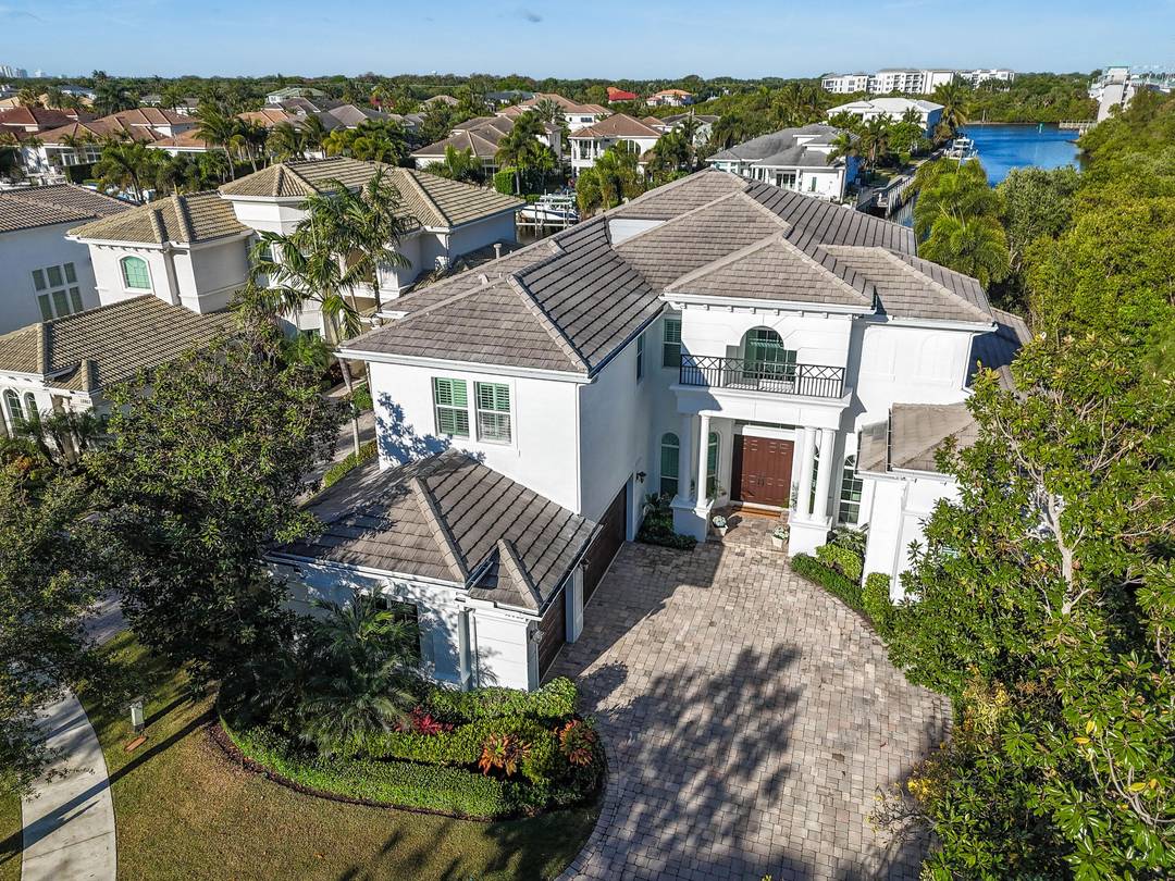 Commanding an extraordinary position along a private canal with sweeping, direct Intracoastal views, this stunning waterfront estate embodies the pinnacle of Palm Beach luxury and maritime living.