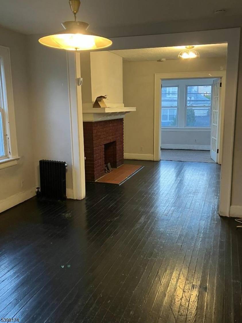 Welcome to Your Investment Opportunity, Charming Two Family Home Nestled In a Desirable Location, property hardwood floors, with detached garage.