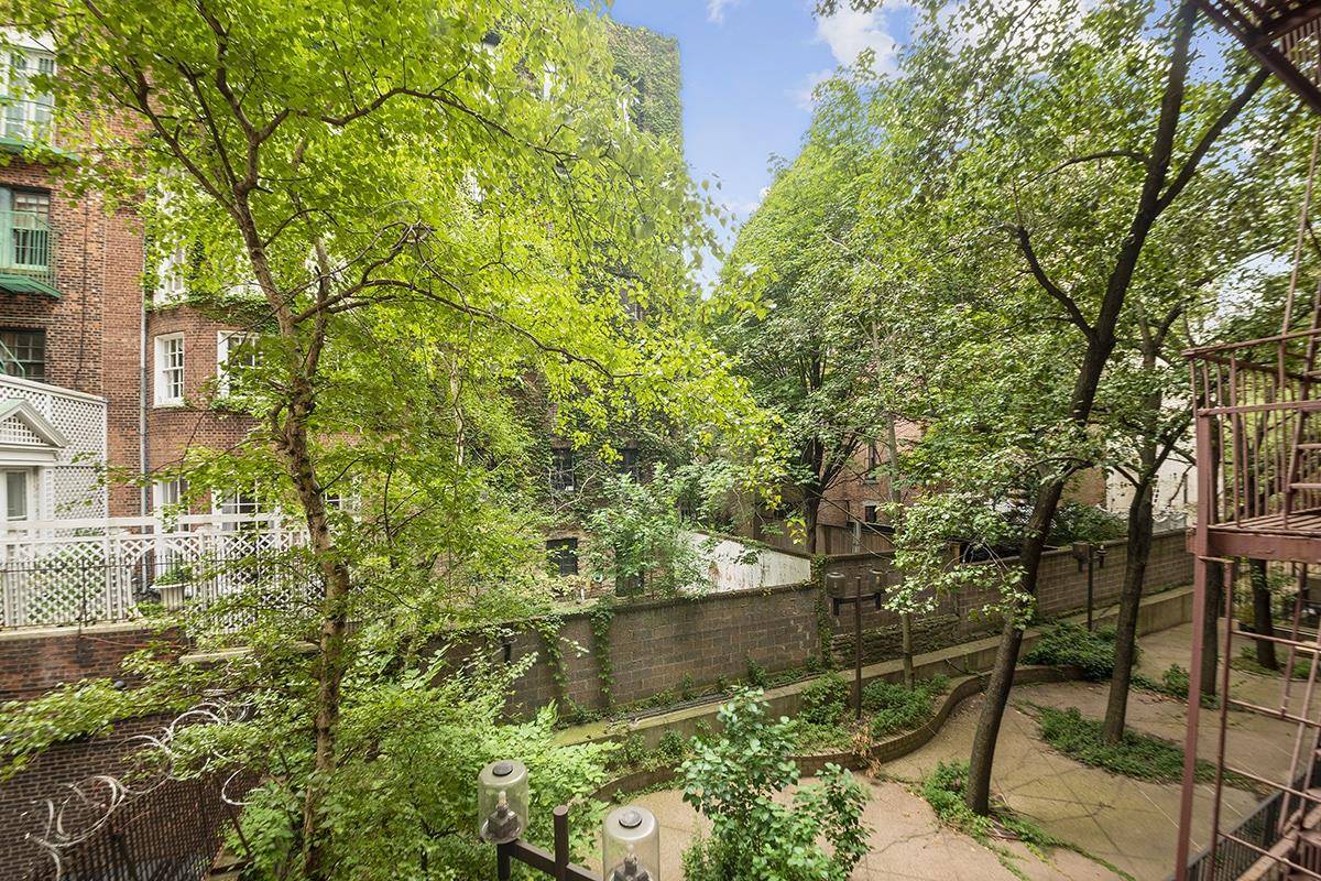 Quiet, oversized one bedroom in Carnegie Hill with a peaceful view of rear gardens, great storage, and a Washer Dryer.