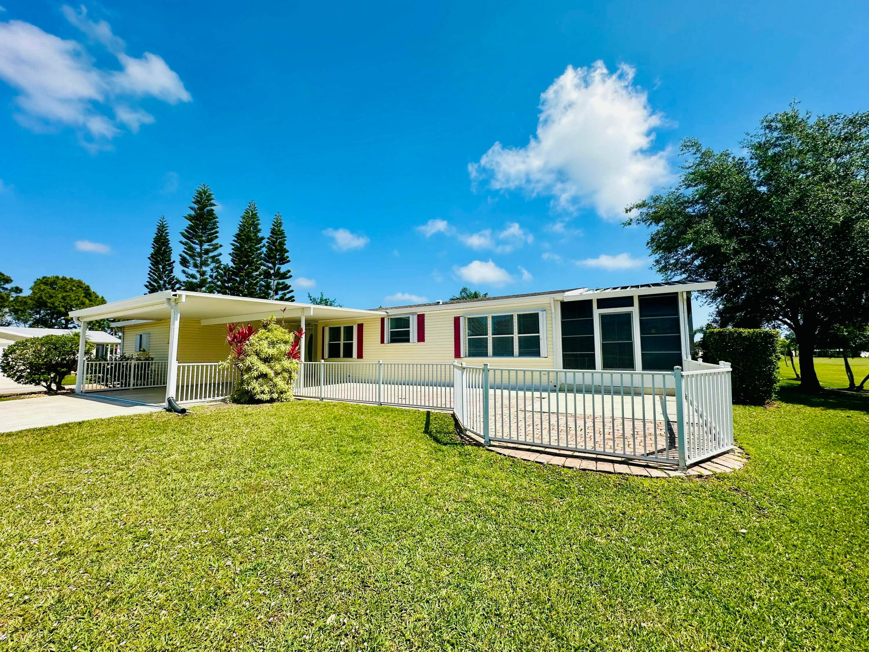 Expanded Coral Reef model on oversized corner lot with golf views in the Savanna Club 55 community.