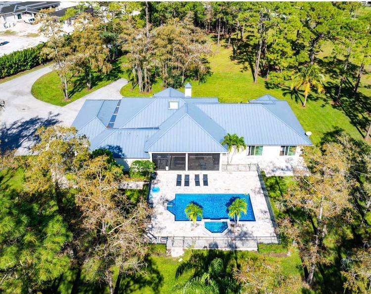 Indulge in the unparalleled opportunity to own your forever home, nestled in serene tranquility on an expansive five acre estate.