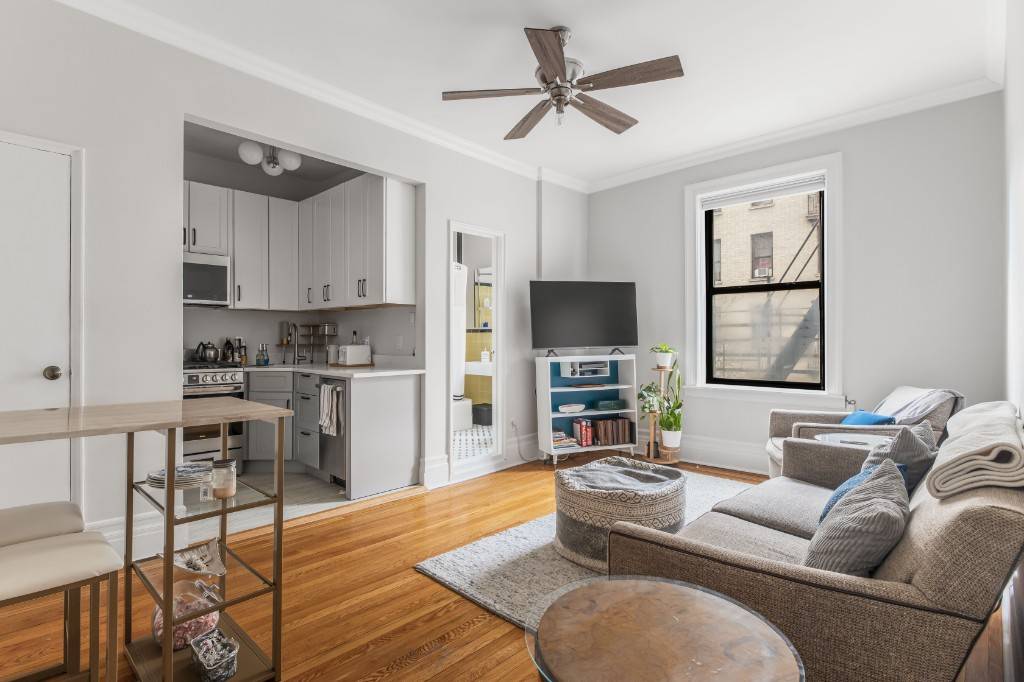 Nestled in a charming pre war building, this stunning apartment exudes elegance.
