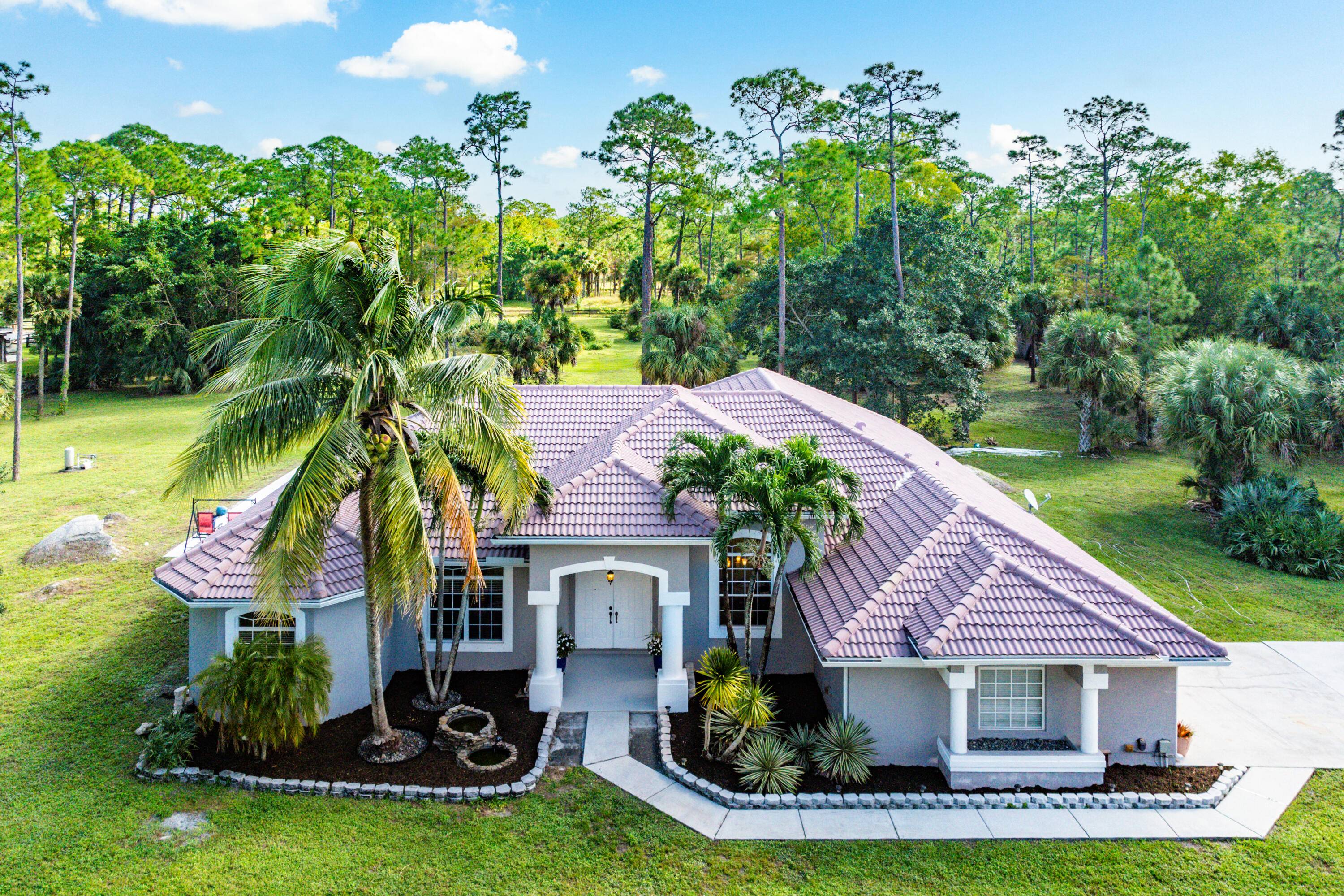 Discover the ultimate blend of luxury and equestrian living with this stunning 5 acre estate in a highly desirable horse friendly gated community Deer Run.