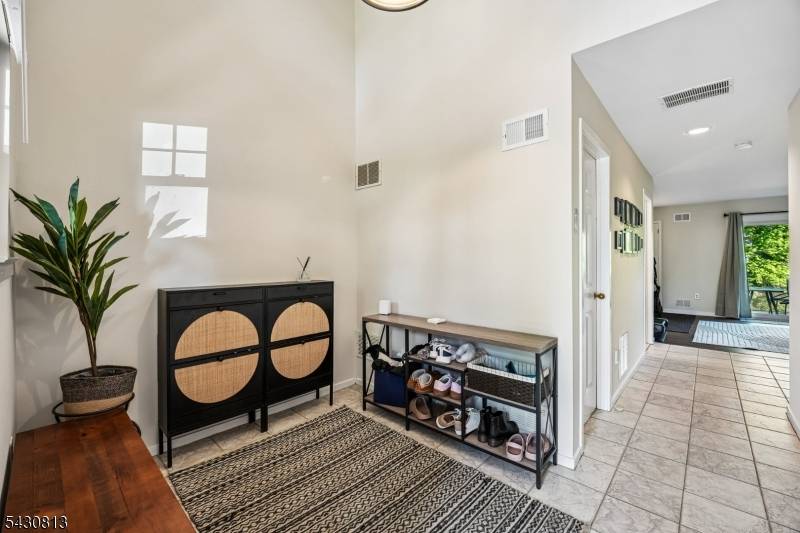 Located at the Crossroads community, this beautifully maintained Bentley model offers stunning pond views, spacious living, and breathtaking sunsets from every level.