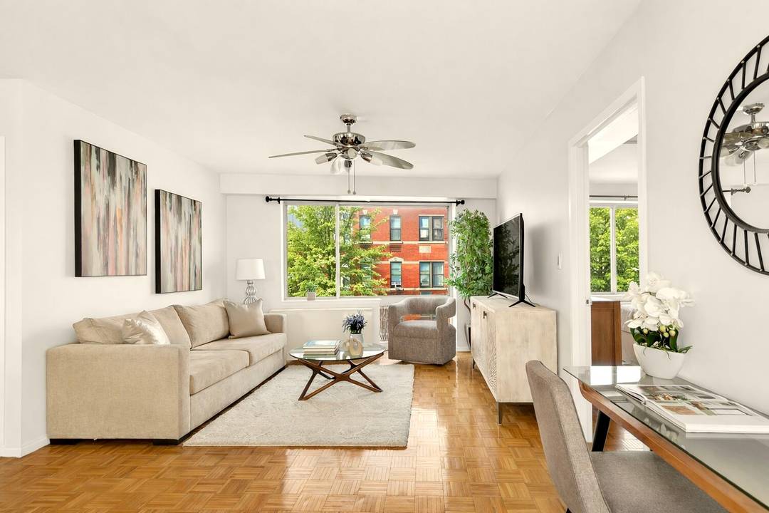 Welcome to Apartment 503, a spacious three bedroom, two bathroom residence spanning 1, 254 square feet with east and west exposures.