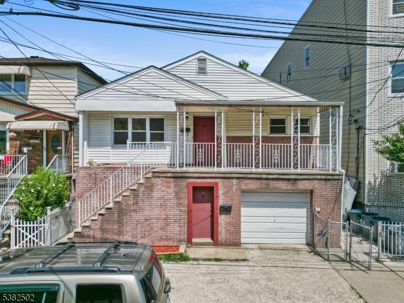 Welcome to 21 W 14th Street, Bayonne a rare opportunity to own a versatile two family home with strong rental income and unbeatable commuter convenience.