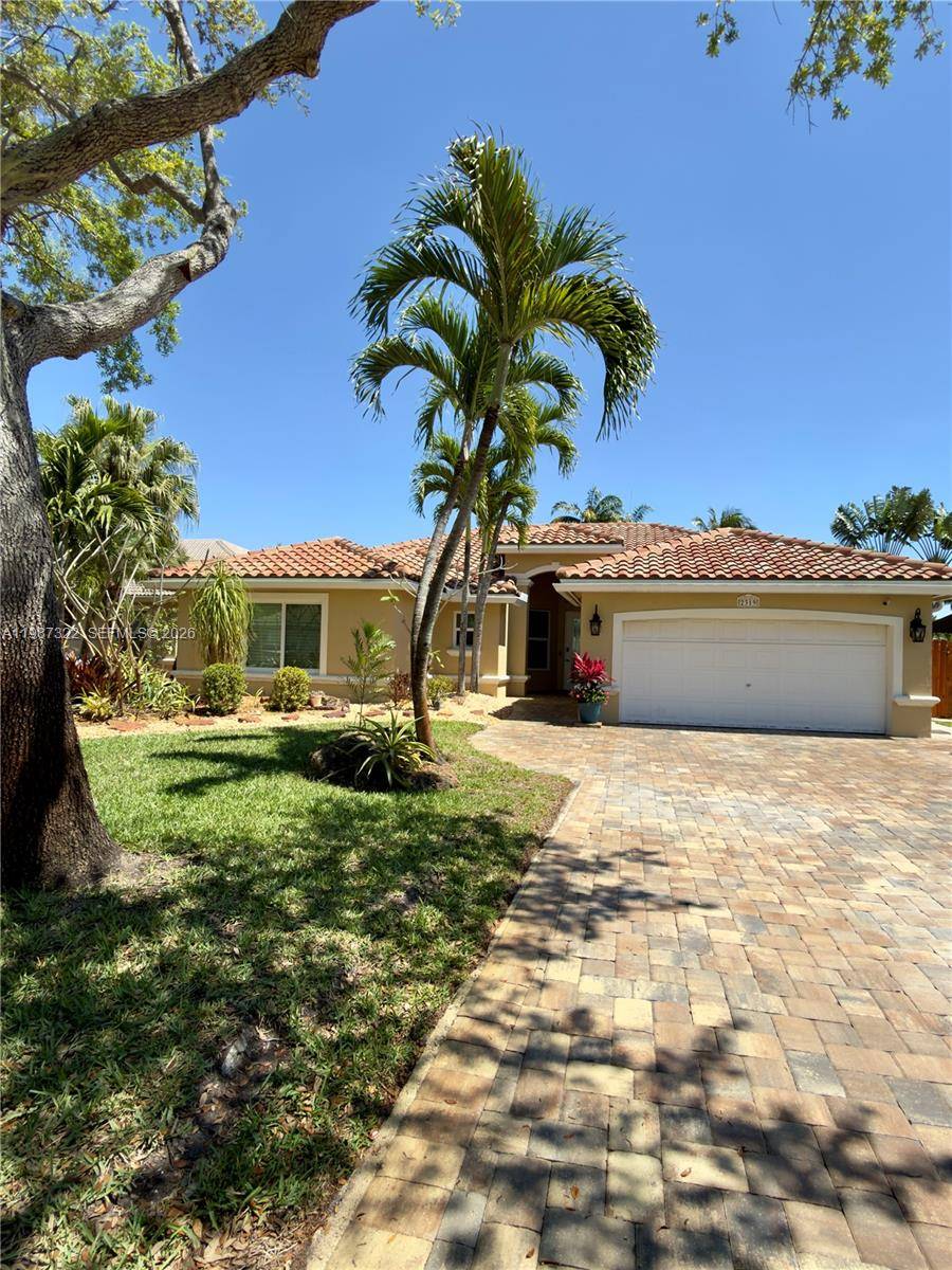 Welcome to this beautifully maintained, one owner home in the highly desirable Keystone Lake community of Pembroke Pines.